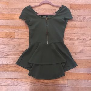 Green zip-up peplum short sleeve top.